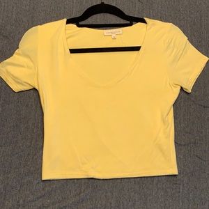 Pale yellow V neck crop top